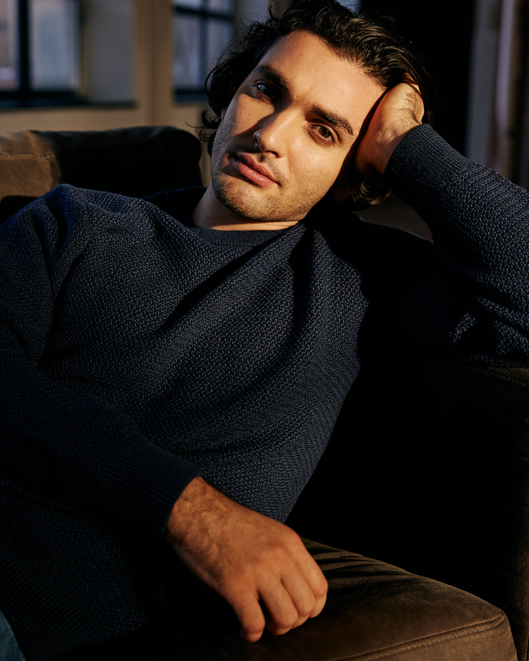 Man wearing merino wool sweater in navy blue color with crew neck from Wolk antwerp