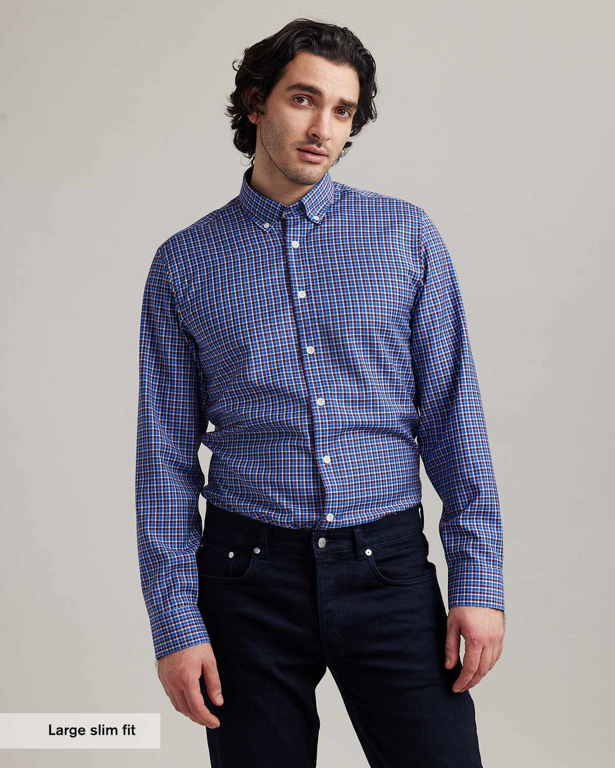 men wears button down merino wool shirt with checks in red white and blue in slim fit