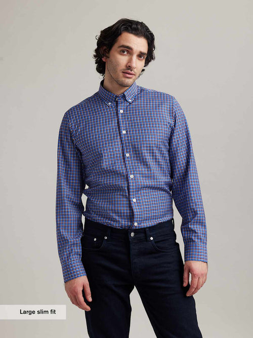 men wears button down merino wool shirt with checks in red white and blue in slim fit