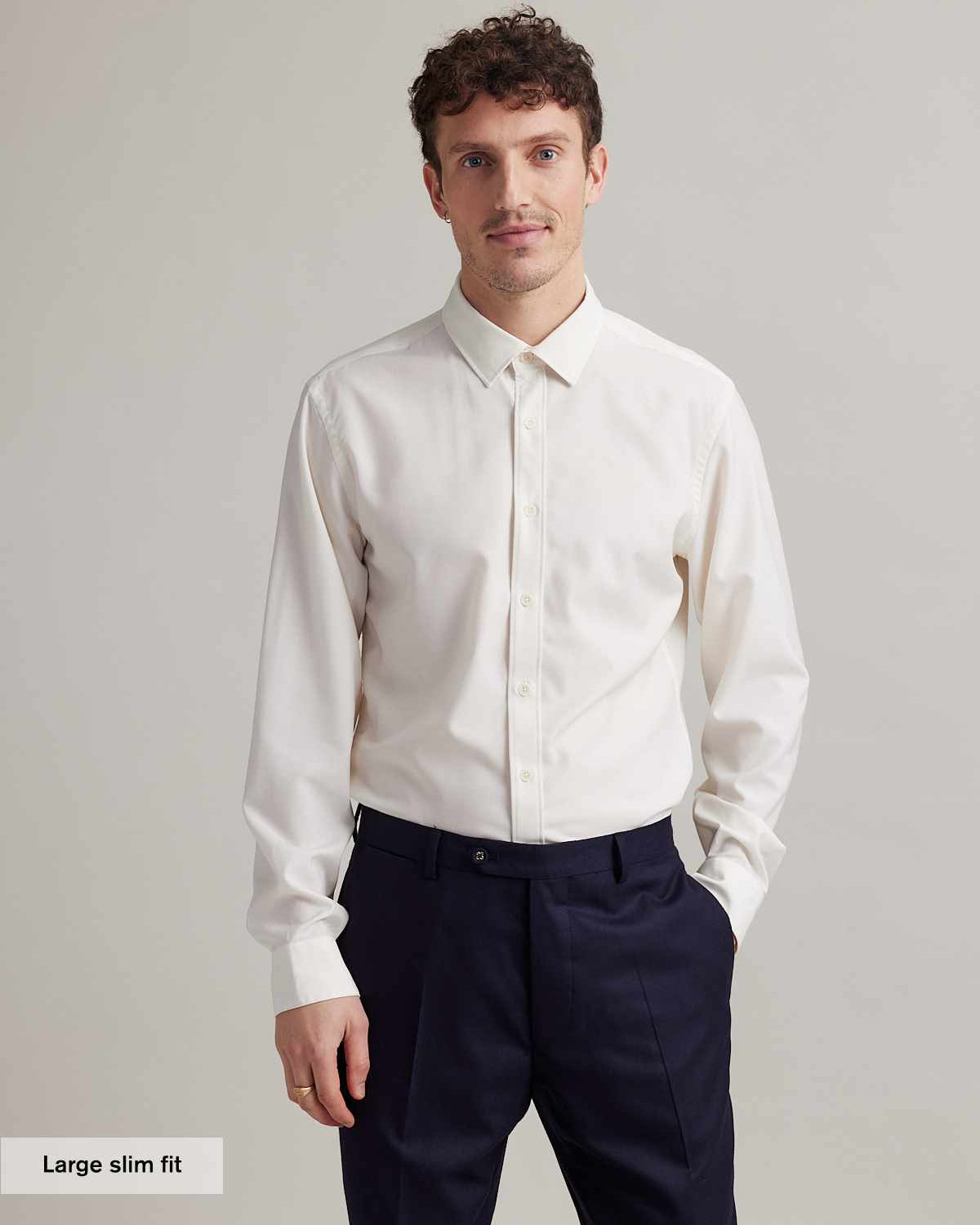 Man wearing a long sleeve merino dress shirt in white in slim fit