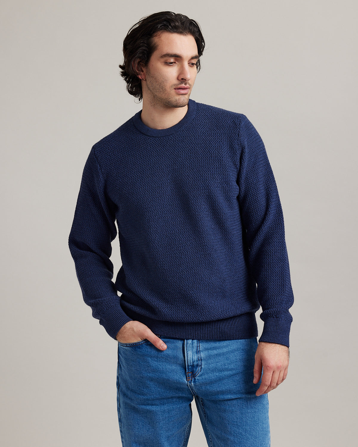 man wearing merino wool knitted sweater with round neck no itch mo shrink made in Portugal with 100% responsible merino wool