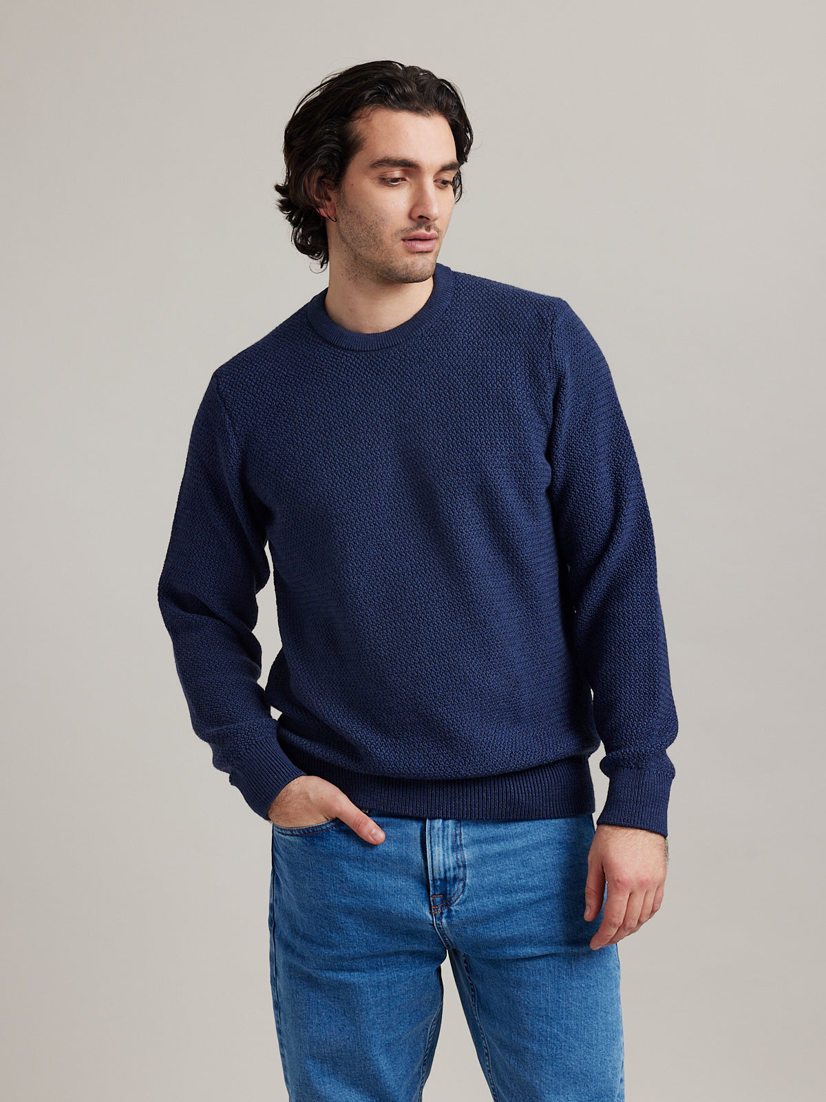 man wearing merino wool knitted sweater with round neck no itch mo shrink made in Portugal with 100% responsible merino wool