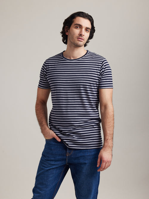 man wearing merino T-shirt with short sleeves in grey and navy stripes