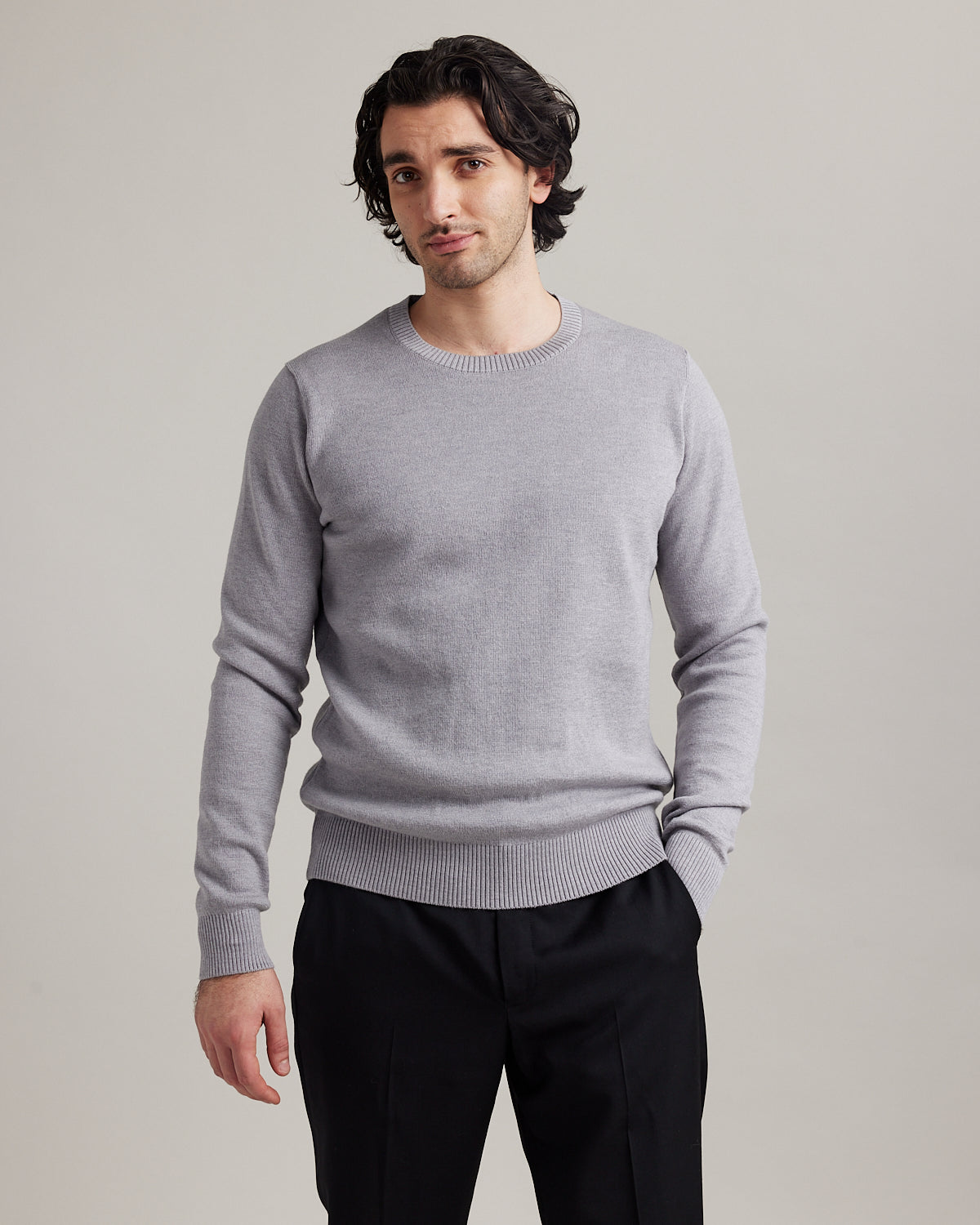 frontside of man wearing a light grey merino wool sweater