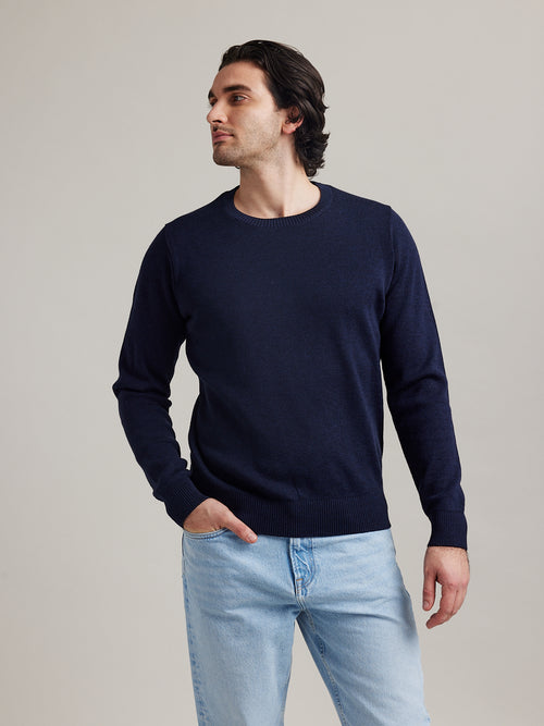 Man wearing a blue navy merino wool sweater with crew neck