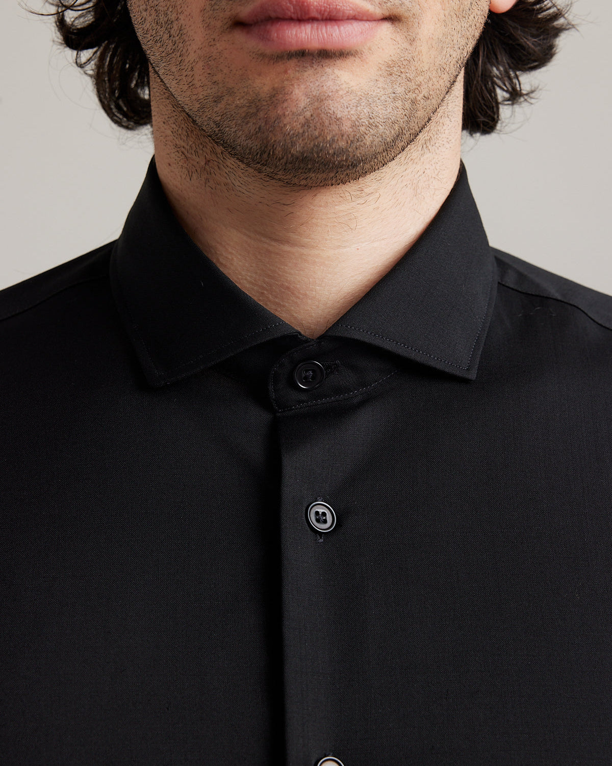 Detail of spread collar on merino wool shirt for men from wolk in black