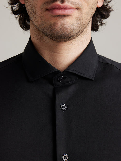 Detail of spread collar on merino wool shirt for men from wolk in black