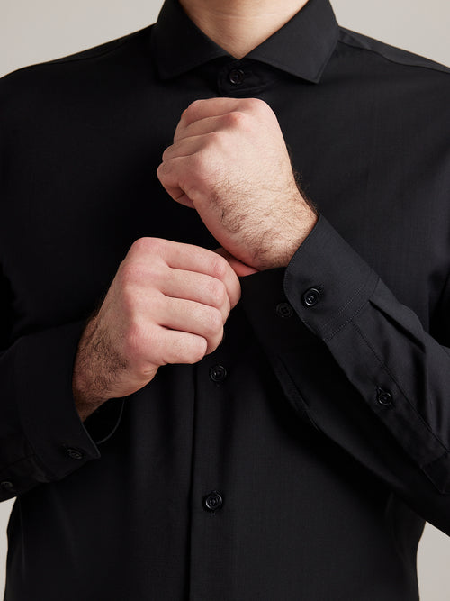 cuffs of merino wool shirt from Wolk in black with black buttons