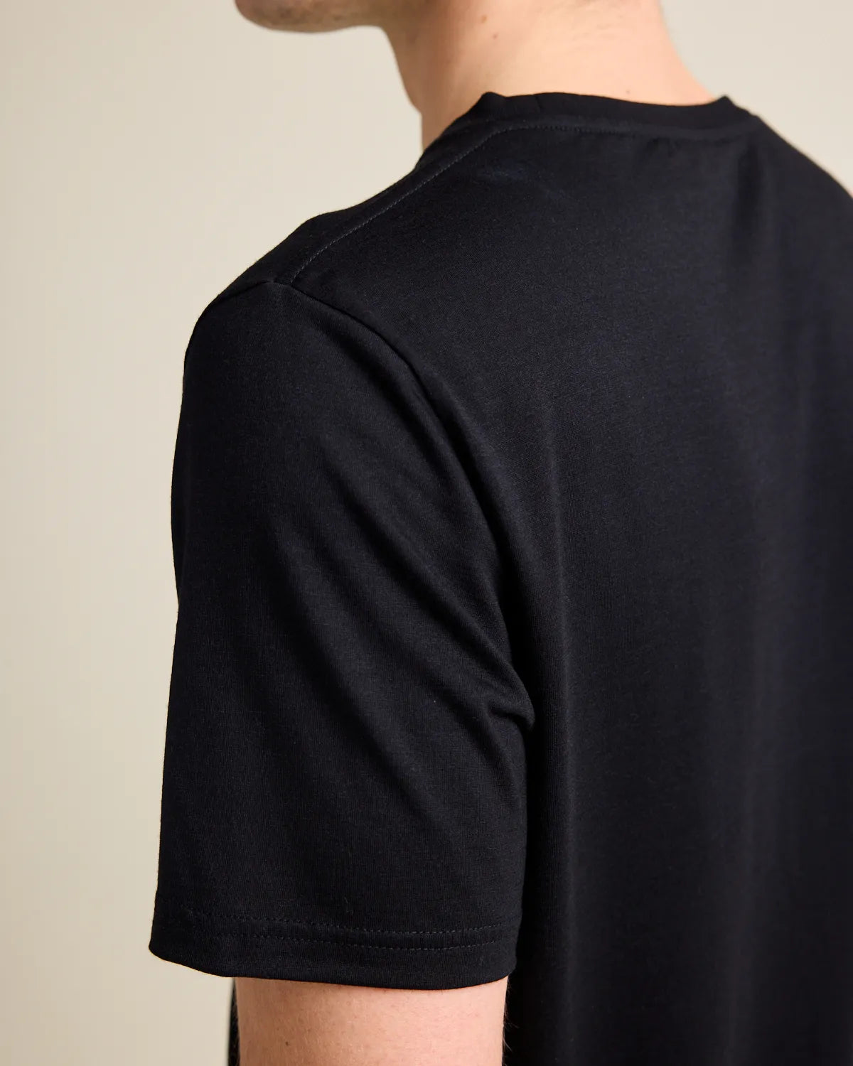 shoulder detail on a bleck merino T-shirt from Wolk