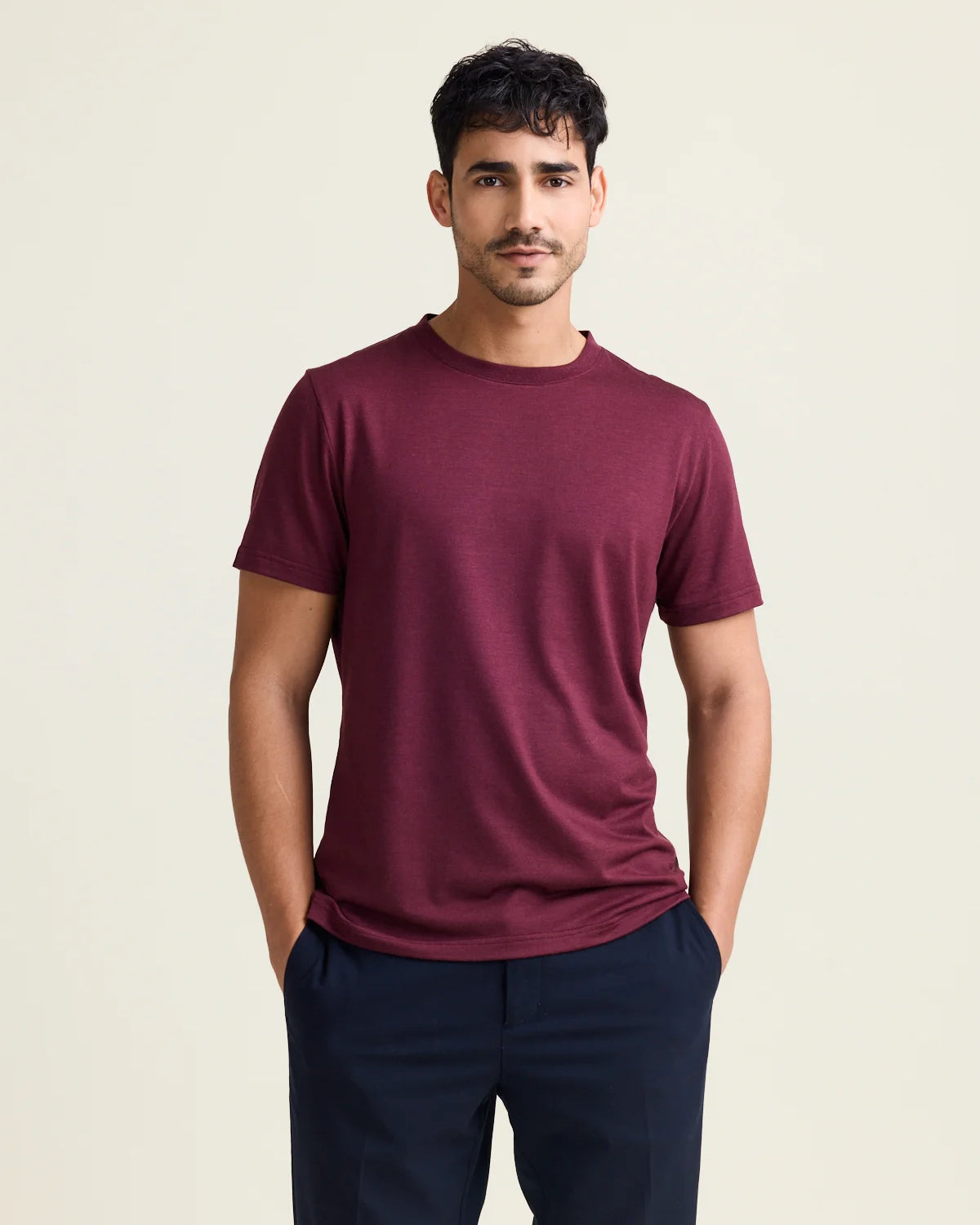 Studio shot of a men's merino wool T-shirt in burgundy, designed by Wolk.