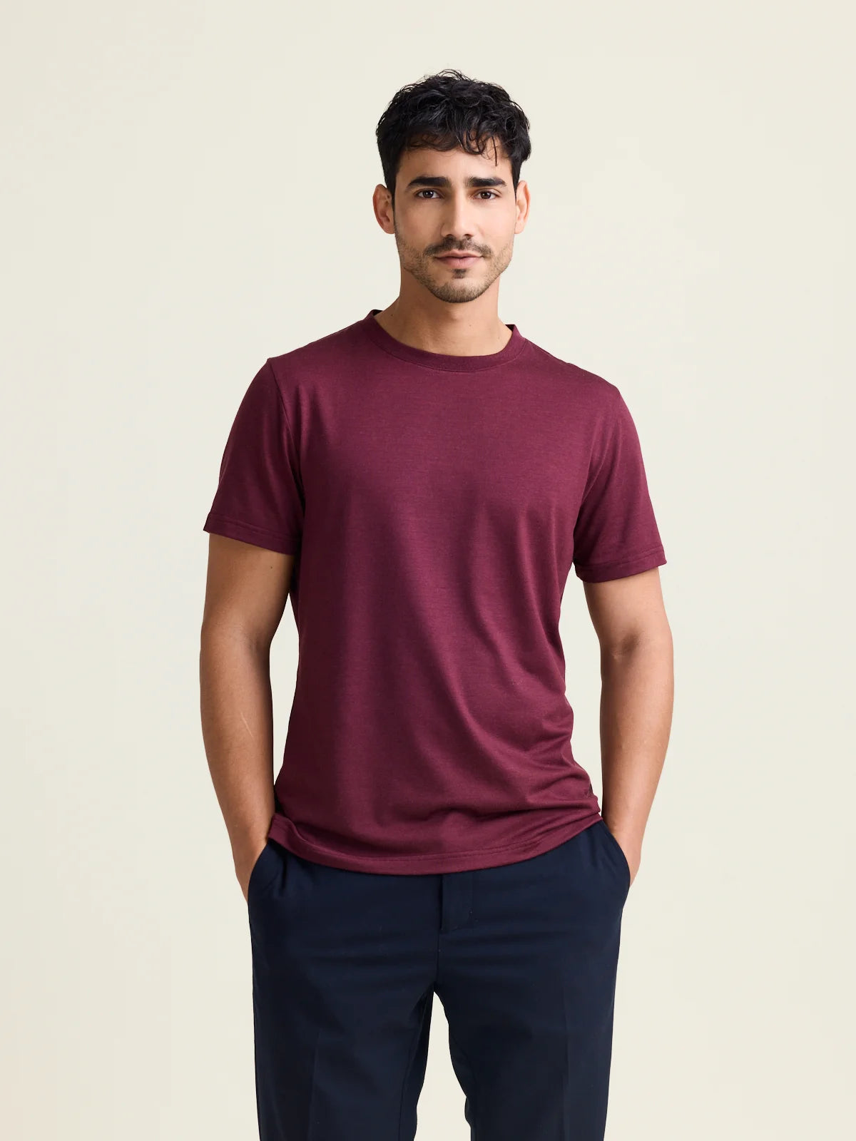 Studio shot of a men's merino wool T-shirt in burgundy, designed by Wolk.