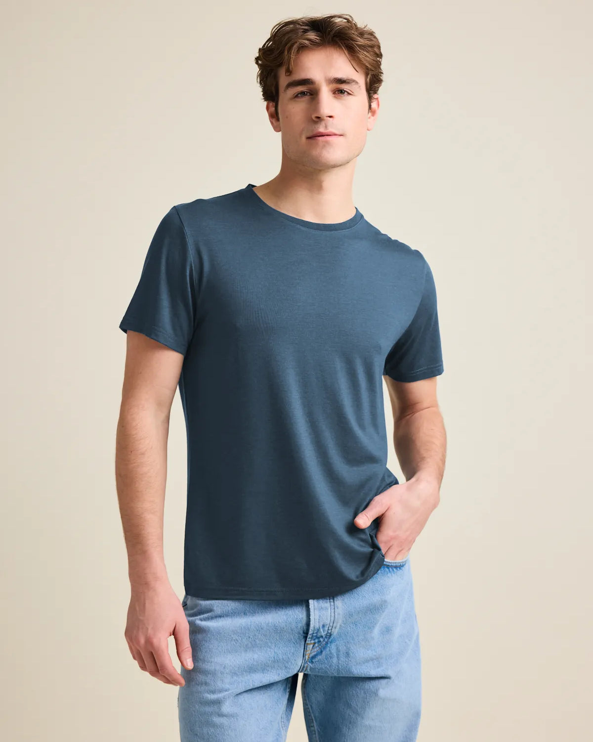 Studio shot of a men's merino wool T-shirt in denim blue, designed by Wolk.
