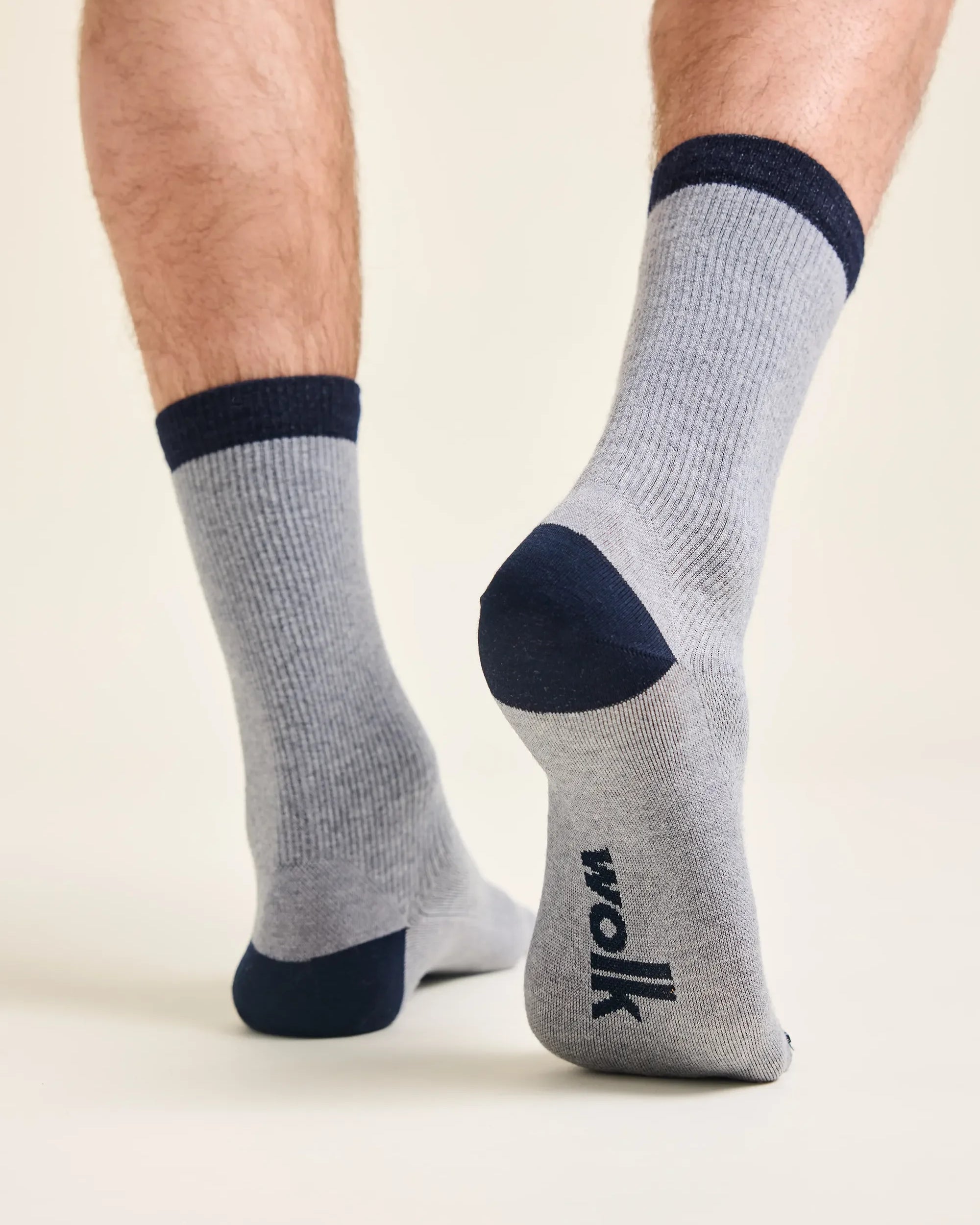 Grey merino wool socks with blue too, heel and cuff. Rib texture and Wolk logo on sole