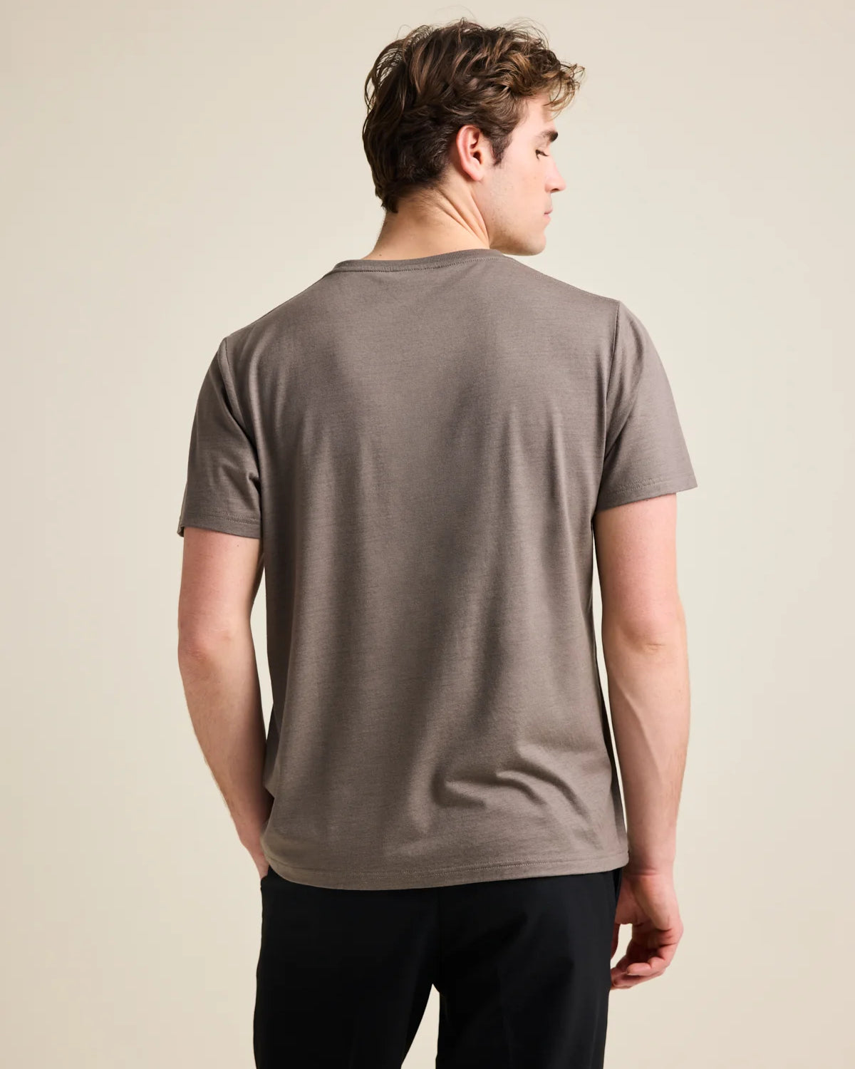 Men's chocolate brown merino wool T-shirt from Wolk, back profile, highlighting smooth fit and finish.