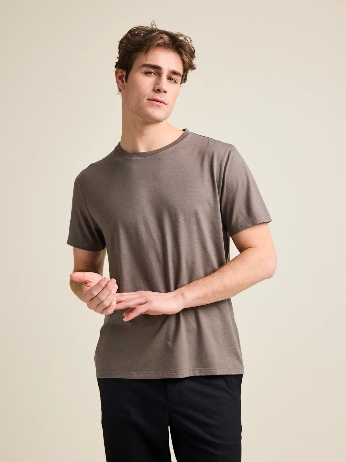 Studio shot of a men's merino wool T-shirt in chocolate brown, designed by Wolk.