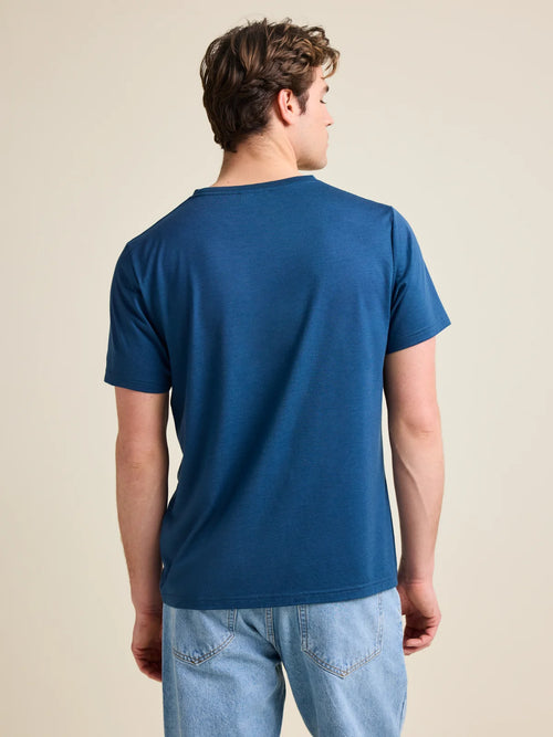 Men's medium blue colored merino wool T-shirt from Wolk, back view highlighting the smooth texture and European craftsmanship.