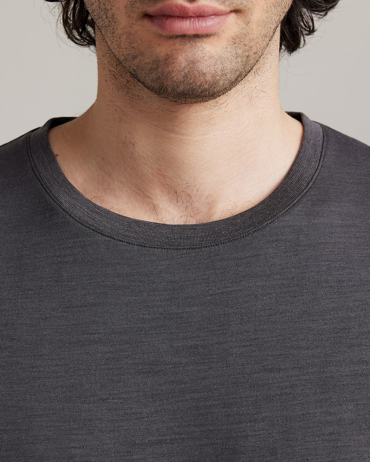 rib knit collar on men's merino wool jersey T-shirt in dark grey from Wolk.
