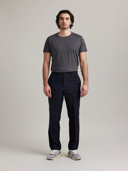 Wolk's dark grey men's merino wool T-shirt in a studio setting, showcasing crew-neck design.