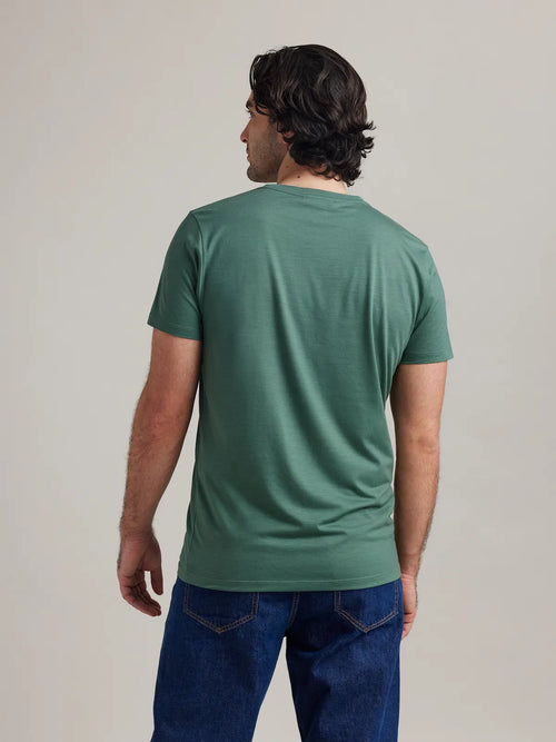 Men's merino wool T-shirt from Wolk, in the color pine green. Back view highlighting the smooth texture and European craftsmanship.