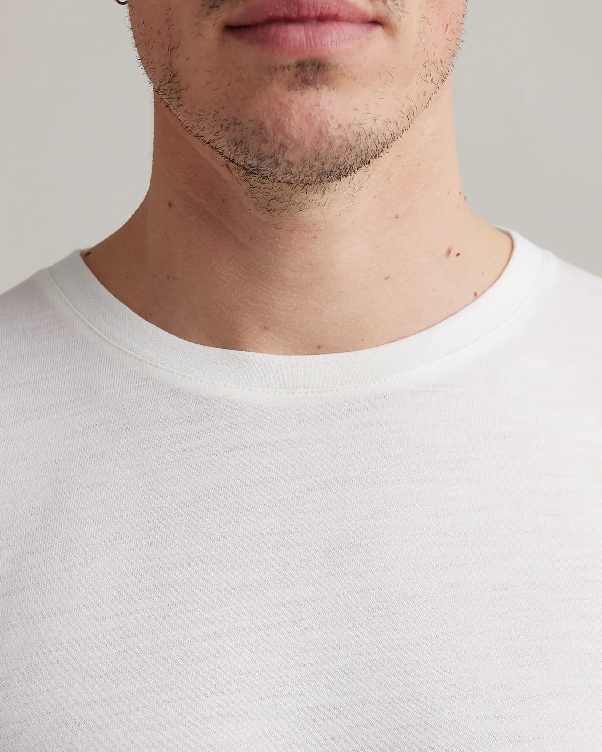 Men's merino wool T-shirt from Wolk in white, displaying the crew neck.