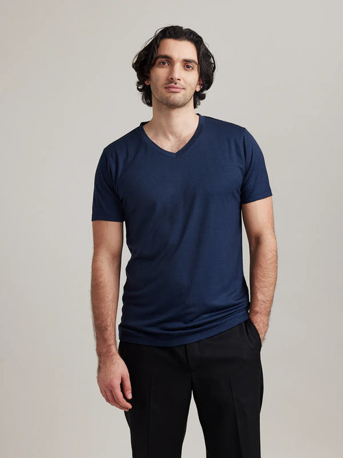 Front view of Wolk's merino wool T-shirt for men in navy with V neck designed for style and breathability, made in Europe
