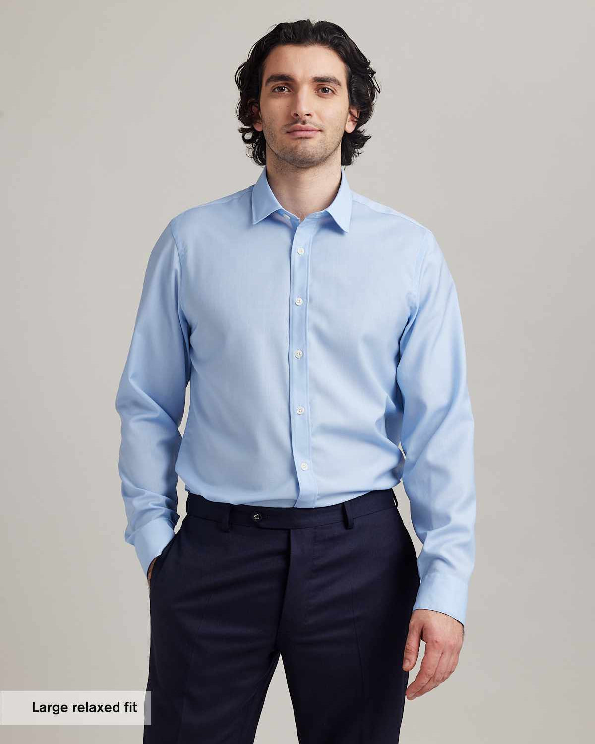 Man wears a merino wool shirt from Wolk antwerp in relaxed fit
