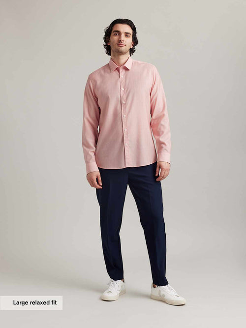 Man wearing casual merino shirt in red hairline stripe with long sleeves from Wolk in relaxed fit