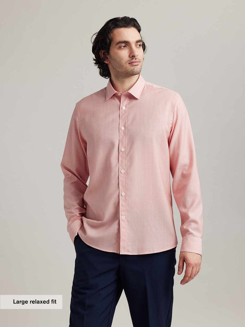 Man wearing casual merino shirt in red hairline stripe with long sleeves from Wolk in relaxed fit