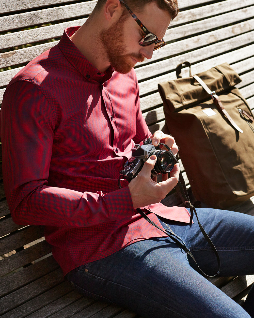 Wolk - man wearing a merino shirt with button down collar in red navy mini gingham and long sleeves