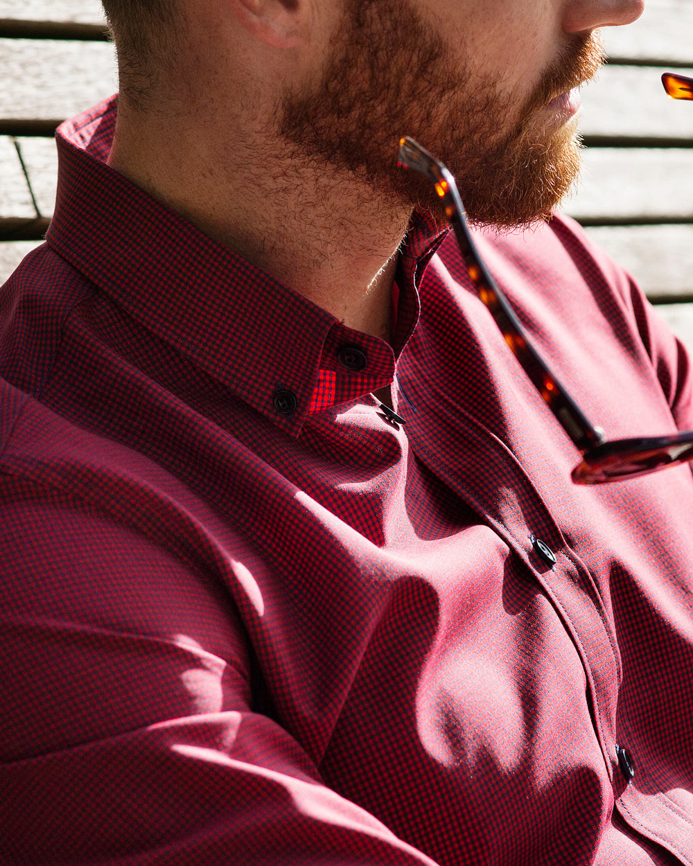 Wolk - man wearing a merino shirt with button down collar in red navy mini gingham