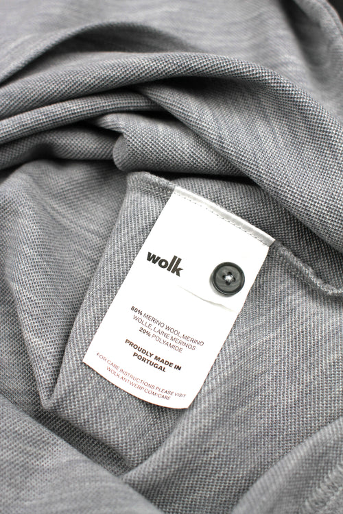Wolk label of merino wool polo in grey melange color made in portugal