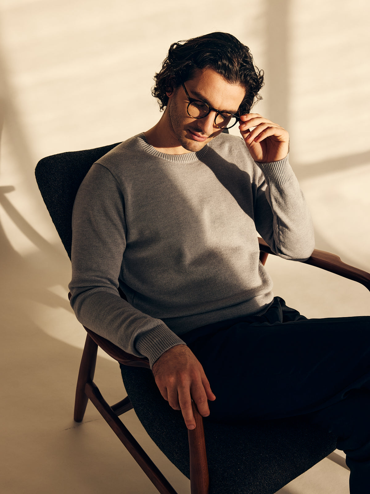 Men wearing merino wool sweater in light grey mid weight 