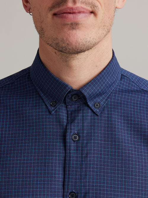 button down collar on navy blue merino shirt with light blue graph check and corozo buttons