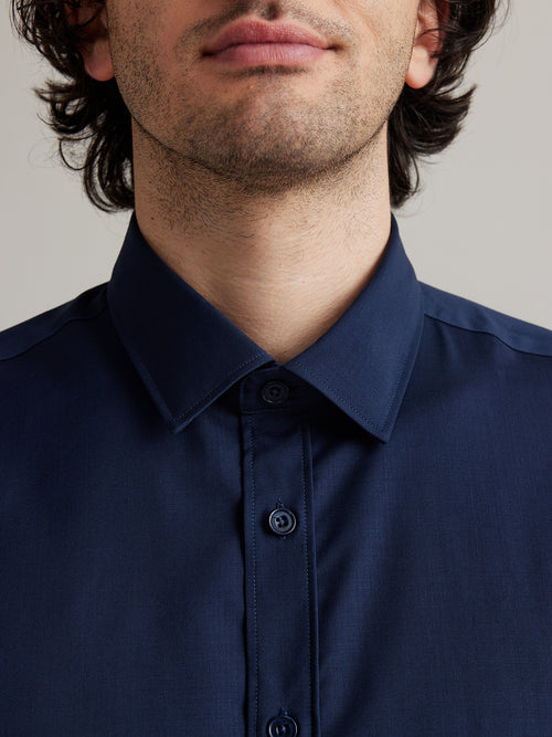 Men shirt in merino wool navy color with classic collar and corozo buttons from Wolk