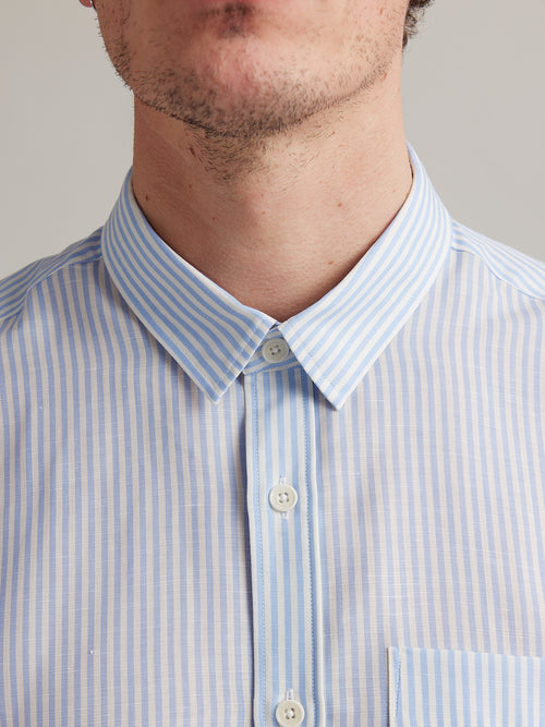 classic collar on merino wool linen shirt for men with light blue bengal stripe and white buttons and chest pocket