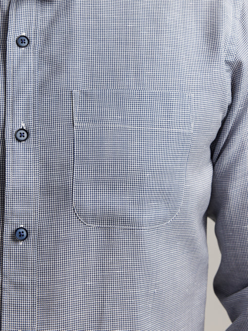 pocket detail of a merino wool and linen shirt from Wolk in dark navy houndstooth