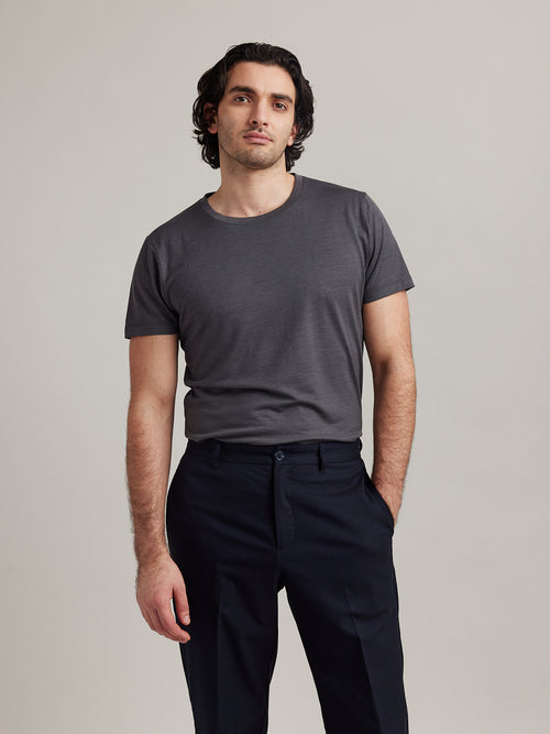 Man wearing short sleeved Climaforce merino wool T-shirt in dark grey color from Wolk