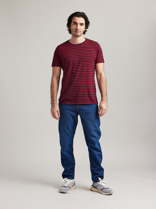 Wolk-Man wearing Climaforce Merino wool T-shirt with short sleeves in red blue stripe and round neck