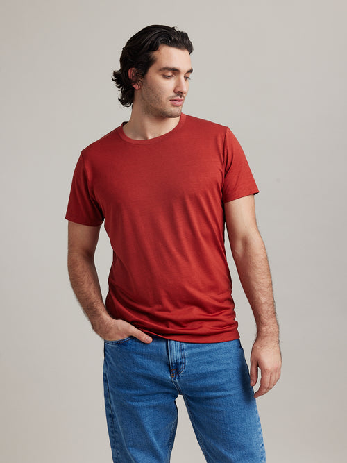 Man wears short sleeve merino wool T-shirt with round neck made in Europe