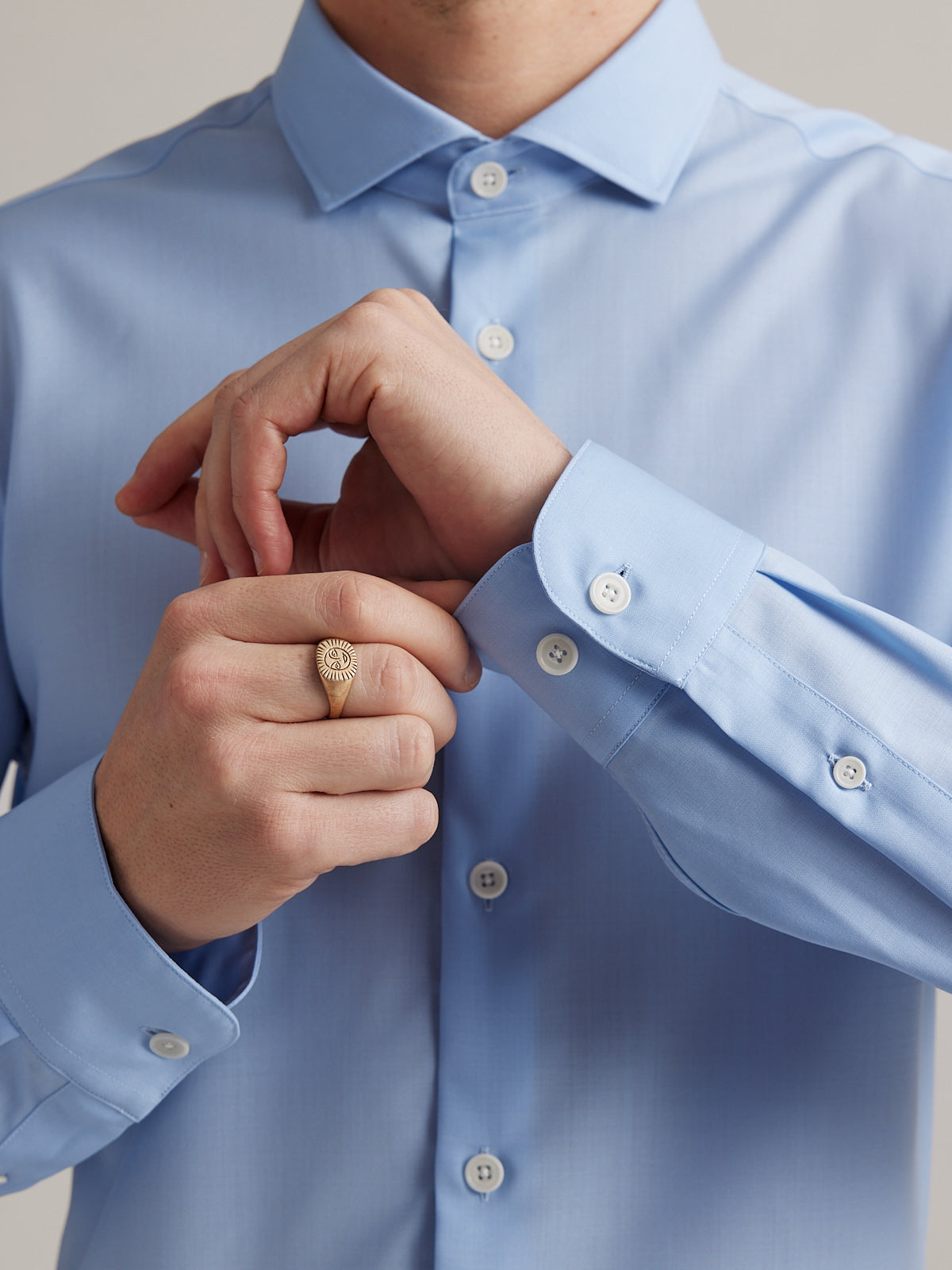 cuff details on men merino wool shirt with long sleeves in light blue with white buttons