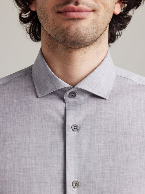 spread collar of light grey merino shirt with corozo buttons in dark grey