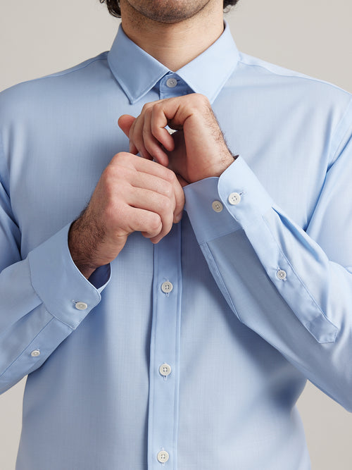 cuff detail of a light blue merino wool shirt from Wolk