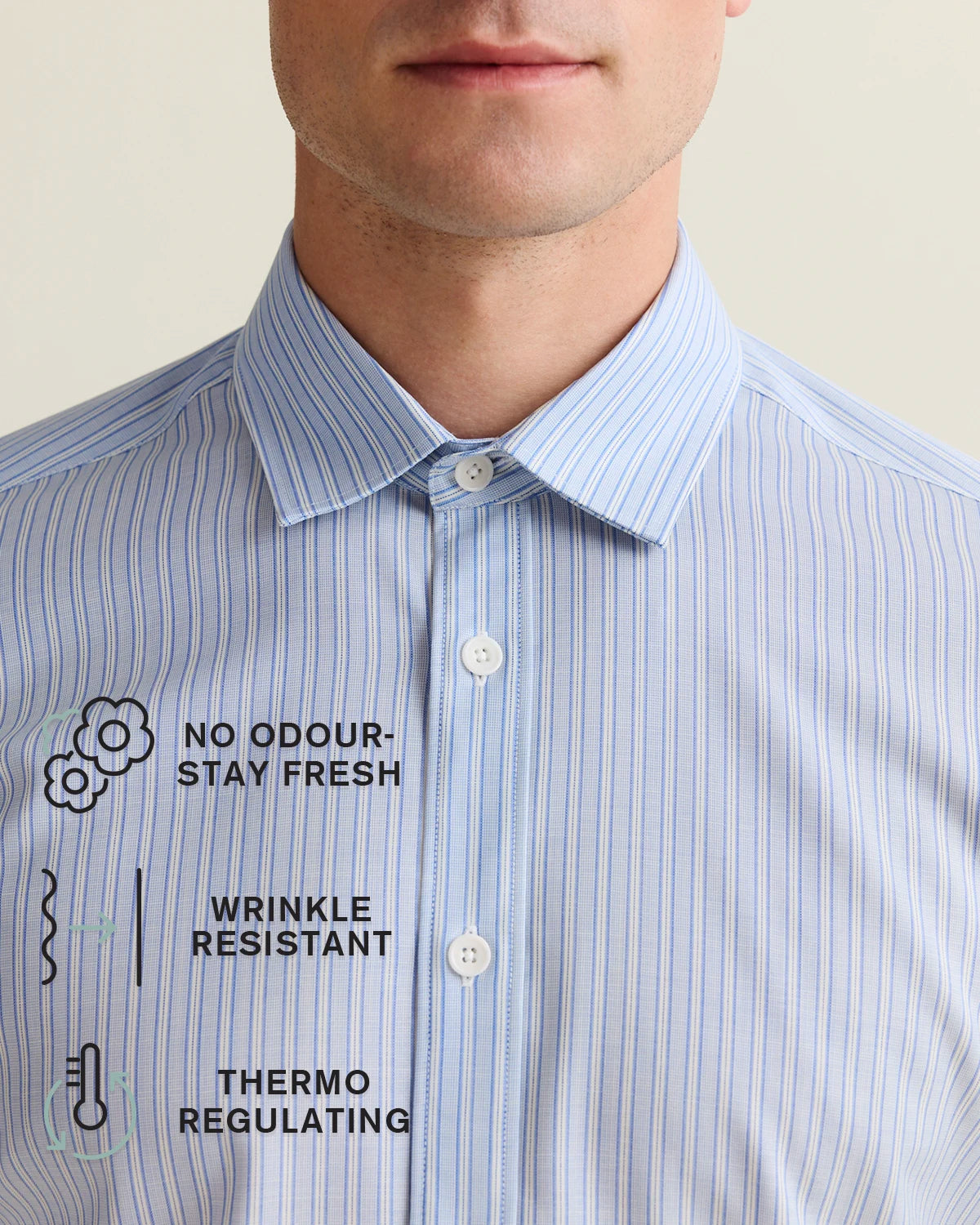 Close-up of a blue striped shirt with text benefits of merino wool written on the picture on a neutral background