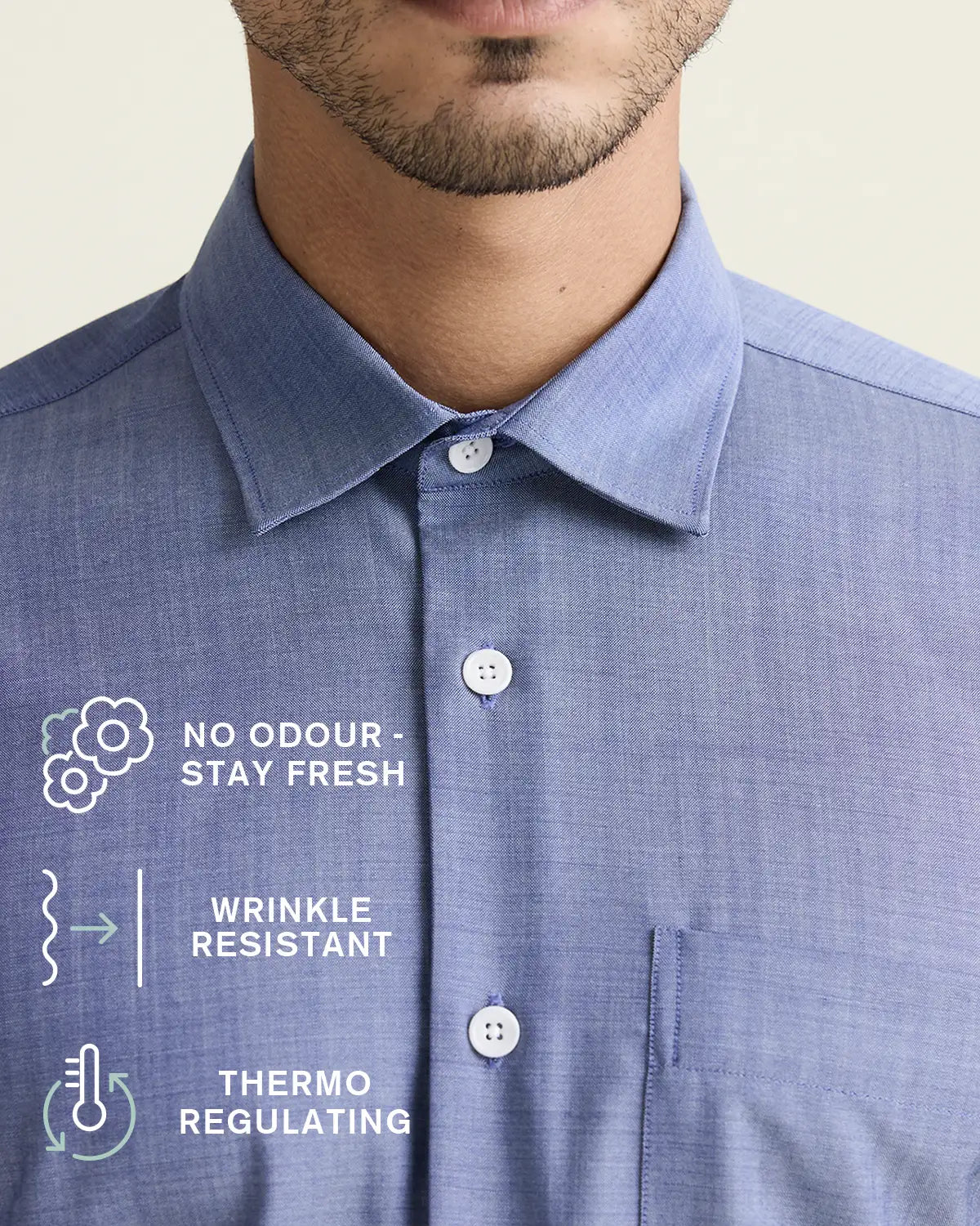 Blue merinowool dress shirt with text indicating features like no odor, stay fresh, thermo-regulating, and wrinkle-resistant.