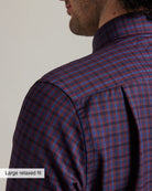 shoulder pleat of a burgundy checkered merino button-down shirt in relaxed fit