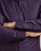 cuff detail on a  burgundy checkered merino button-down shirt from the brand Wolk