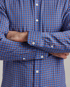 cuff detail on a blue/red checkered merino wool button down shirt