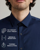 Navy blue merino dress shirt with text highlighting features no odour-stay fresh, wrinkle resistant, thermo-regulating