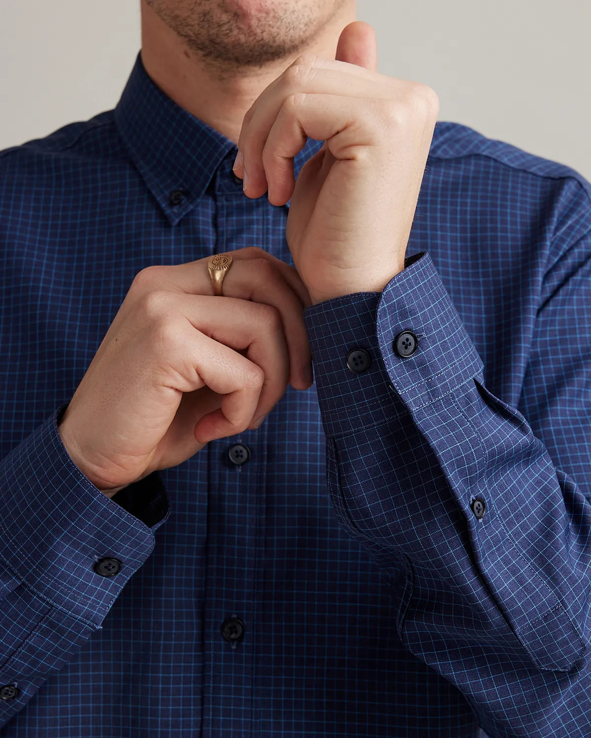 cuf detail on a navy blue merino wool shirt with graph check pattern and button down collar