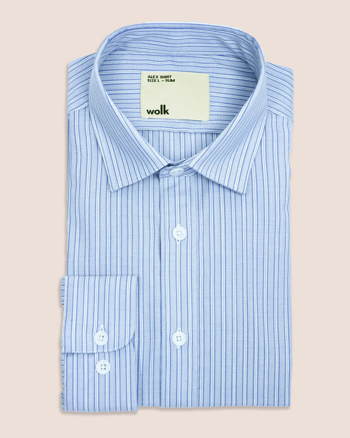 Light blue striped merinowool formal shirt with a visible Wolk brand label on a beige background